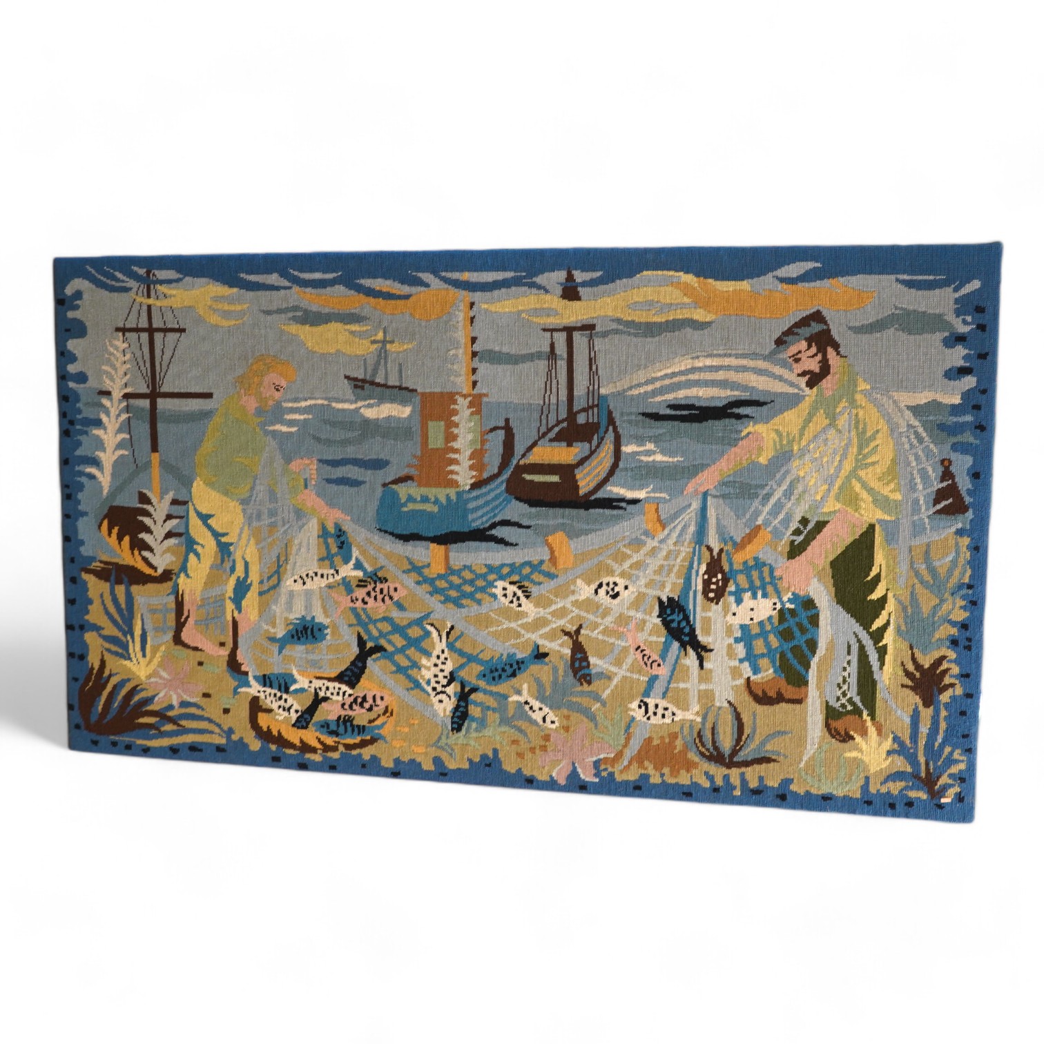 A French modernistic needlework panel of fishermen with nets possibly a local Brittany scene, 137cmwide x 78cm high. Condition - good